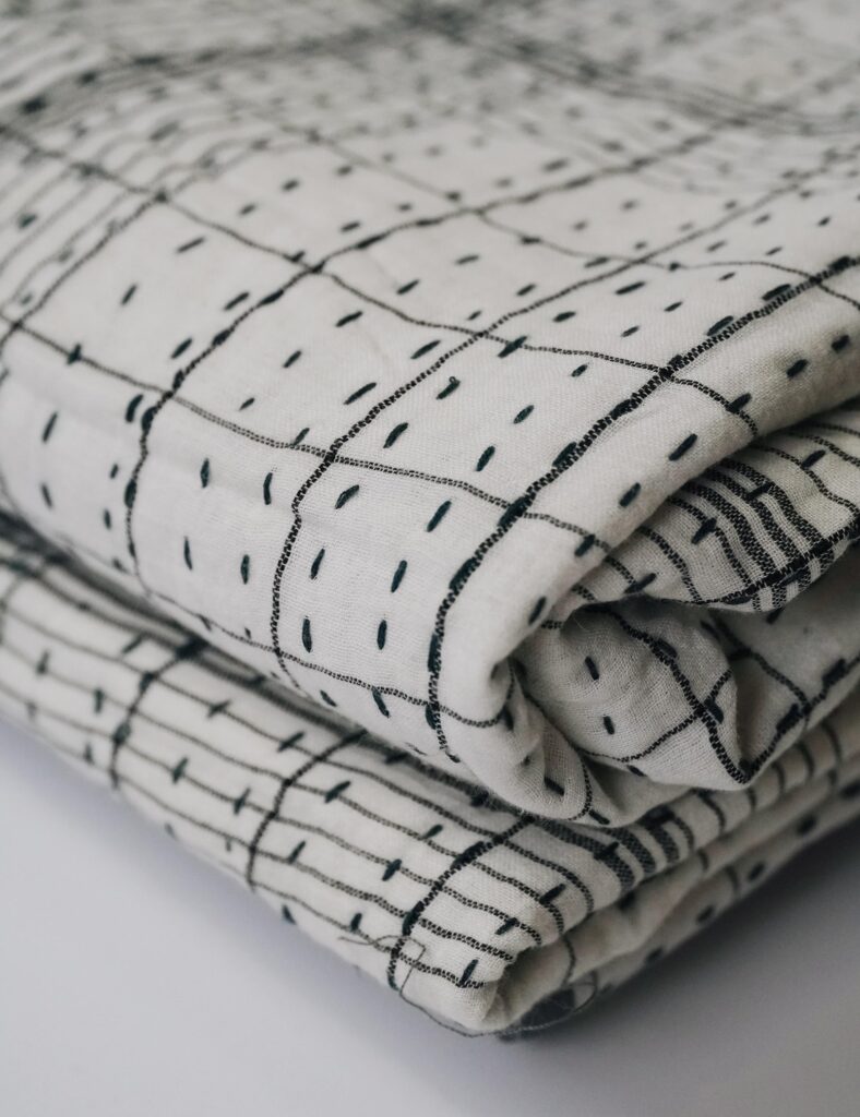 Kantha stitching, black on white muslin-min