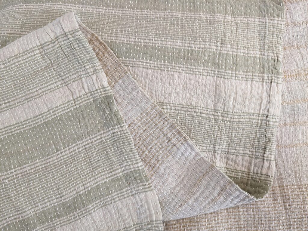 Quilt- white, sage, and mustard detail Muslin and kantha stitching