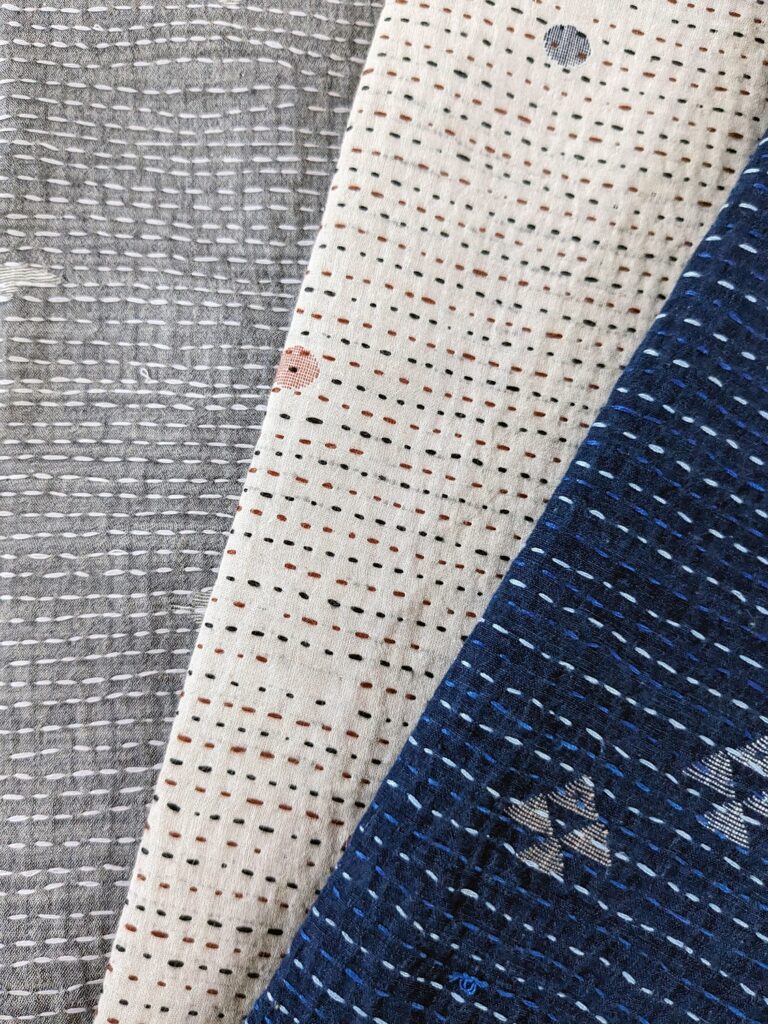 Trio of baby blankets detail Muslin jamdani with kantha stitching