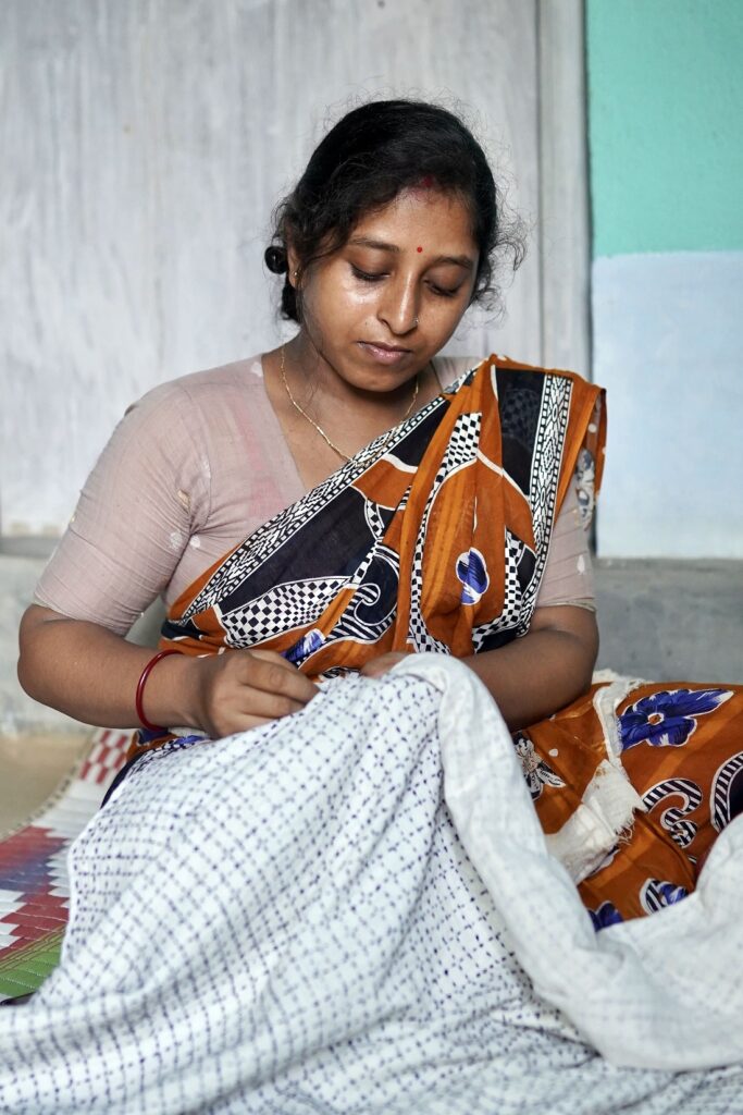 Woman stitching throw- edited